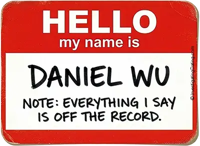 A close-up of a red 'Hello my name is' sticker reading 'DANIEL WU' in neat all-caps. A disclaimer written underneath reads: 'NOTE: EVERYTHING I SAY IS OFF THE RECORD.'
